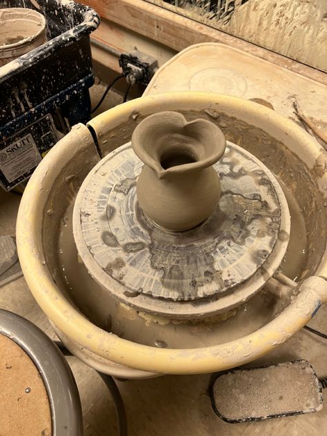 an unfired heart shaped vase made from clay sitting on a potter’s wheel. Art, Mugs, Diy, Pottery, Crafts, Hand Thrown Pottery, Ceramics Pottery Art, Ceramics Ideas Pottery, Pottery Studio