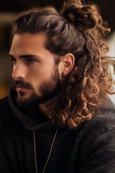 Long curly locks styled into a man bun add a touch to your look. If you have messy curls pulling them up into a man bun at the back of your neck can add an element of sophistication. Click here to check out more best curly hairstyles and haircuts for men. Man Bun Curly Hair, Men Curly Hairstyles, Long Hair On Men, Men Curly Hair, Man Bun Hairstyles, Curly Hair Man Bun, Man Bun Styles, Haircuts For Men, Curly Hair Men