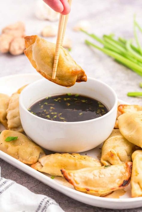 This pot sticker dipping sauce is quick, easy, and full of flavor — the perfect sauce for your dumplings! Soy sauce and vinegar give it a tangy kick, while ginger and garlic provide a subtle heat. But the real secret to this sauce is sesame oil. Serve it alongside your favorite potstickers! Oriental, Dips, Apps, Dipping Sauces Recipes, Dipping Sauces, Dipping Sauce, Potsticker Dipping Sauce, Garlic Dipping Sauces, Asian Dipping Sauce Recipes