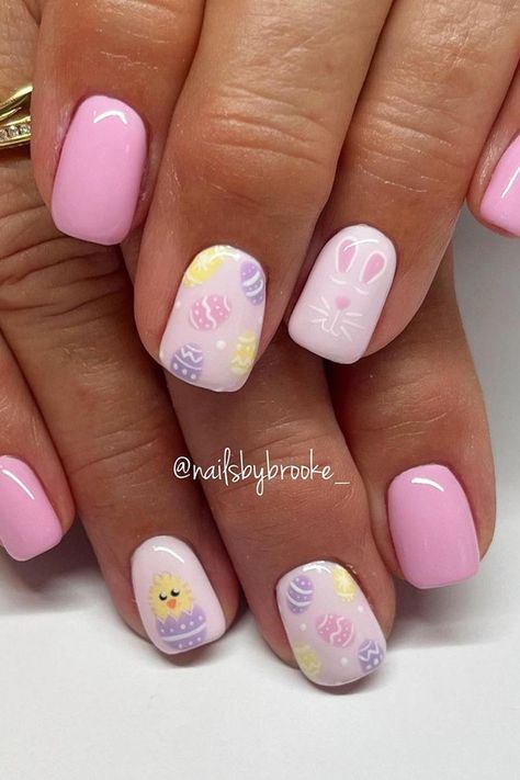 Get in the Easter mood with these adorable pastel pink squoval nails! 🌸🐣 Click through to see the charming chick, bunny, and multicolor Easter egg accents. Perfect for springtime celebrations! // Photo Credit: Instagram @nailsbybrooke___ Accent Nails, Nail Art Designs, Pink, Easter Themed Nails, Easter Nail Designs, Easter Nail Art, Easter Color Nails, Bunny Nails, Easter Nails Design Spring