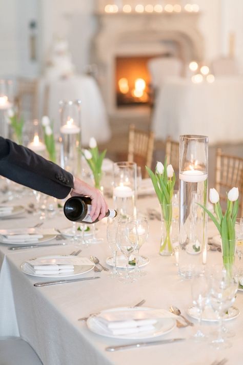 White tulips and floating candles for a simple yet classic long tablescape. Photography: @julianatomlinsonphotography Venue: @parkchateau Flowers: @leighflorist #parkchateau #estatewedding #leighflorist #weddingflowers #weddingflorist #bridalbouquet #boutonniere #njweddingflorist #phillyweddingflorist #januarybride #januarywedding #winterbride #winterwedding #tulips Decoration, Wedding Centrepieces, Spring Wedding Centerpieces, Tulip Centerpieces Wedding, Tulip Wedding Decorations, Flower Table Decorations, Wedding Centerpieces, Wedding Table Flowers, Wedding Table Settings