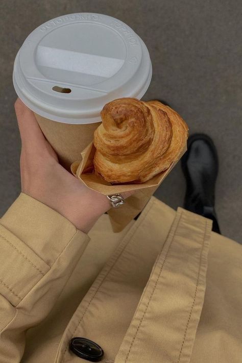 Woman wearing camel coloured mac and black boots holding croissant and takeaway coffee Instagram, Aesthetic, Fotografie, Autumn Aesthetic, Autumn Instagram, Aesthetic Pictures, Aesthetic Photo, Girly Images, Autumn Inspiration