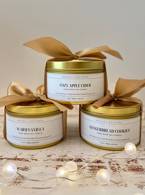 As weather is getting colder, we are all looking for a way to warm up and get cozy ! Our new Gold Tin Candles are perfect for this time of year! We have implement the crackle of a fireplace with the cozy feel of a cottage to bring you a beautiful candle.  Our Hand-poured 16 oz candles our made with a sustainable source of high quality soy wax, and premium fragrance oils. They provide a nice subtle warm throw without the headaches and they last over 30+ Hours of burn time. They are also refillabl Home-made Candles, Candle Jars, Candle Tin Labels, Candle Making, Candle Making Business, Candle Packaging, Candle Smell, Diy Candles With Flowers, Diy Candles