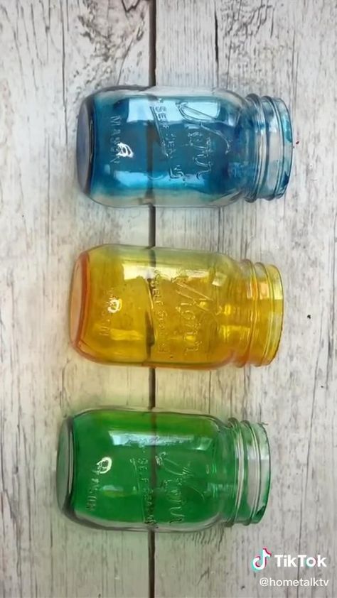 How to tint mason jars! [Video] | Mason jar crafts diy, Diy jar crafts, Diy bottle crafts How To Use Mod Podge On Glass Mason Jars, Tinted Jars Diy, Diy Color Glass Jars, Tint Glass Diy, Old Jar Crafts, Mason Jar Toppers Diy, Sea Glass Jars Diy, Diy Stained Glass Jars, Tinted Mason Jars Diy