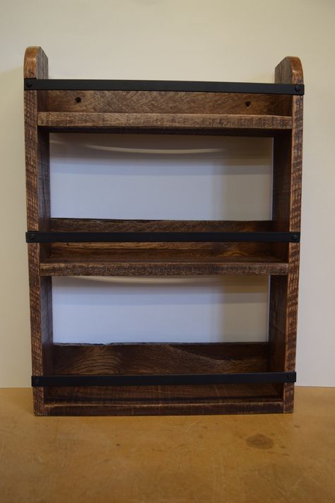 This wall mounting, or counter top spice rack is made of rustic reclaimed pallet wood. I hand select the pallets in order to make sure that I produce products with the best quality of reclaimed wood possible. All items are handmade in my Kansas work shop. The rack is 13 1/4 in wide, 18 in tall, and 3 1/4 in deep. The rails are made of metal. There are holes pre-drilled in the rack to make hanging it on a wall simple. This rack could also be used to display items, or for hanging storage. *ALL PICTURED ITEMS WERE STAINED WITH DARK WALNUT* You may select whichever stain you prefer upon checkout. Refer to stain chart in listing pictures. Diy, Ideas, Woodworking Projects, Metal, Wood Spice Rack, Repurposed Wood, Spice Rack Design, Reclaimed Pallet Wood, Cool Woodworking Projects