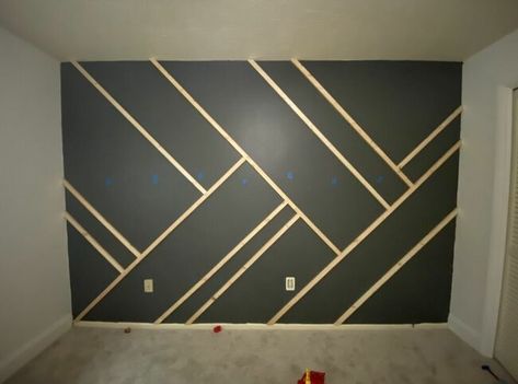 Give your wall some dramatic character with this easy to-do accent wall! Paint the wall I started by painting the wall and the baseboard with the color intended for the whole wall. Mark the studs Using a stud finder, we marked where all the studs in the wall were using blue painter's tape. Cut your wood We used 1"x2" furring strips. We measured the length of the wall where we wanted to place the first piece of wood. I recommend doing your longest lines first. Cut both ends… Interior, Accent Walls, Design, Home Décor, Accent Wall, Accent Wall Designs, Wall Paneling, Accent Wall Bedroom, Wood Accent Wall Bedroom