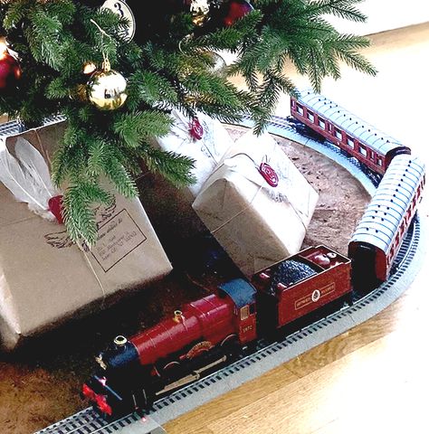 The Hogwarts Express train travels around the base of this Harry Potter themed Christmas tree filled with DIY ornaments. Disney, Harry Potter, Winter, Harry Potter Christmas Ornaments, Harry Potter Christmas Tree, Harry Potter Christmas Decorations, Harry Potter Themed Christmas, Hogwarts Christmas, Harry Potter Christmas