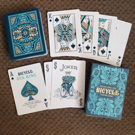 This is a new deck, very nice tuck case with the two tones of aqua blue & gold foil. The cards do not have foil but gold tone. Generic court cards. And only the Ace of Spades has the Sea King face detail. Card Games, Harry Potter, Playing Card, Playing Cards, Bicycle Playing Cards, Custom Decks, Deck Of Cards, Board Game Design, Pack Of Cards