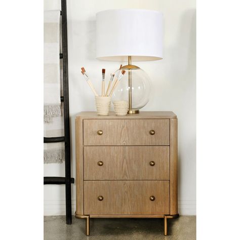 Create a bohemian look to your bedroom with this mid-century modern three-drawer nightstand, designed in a lovely blonde-like sand wash hue and wire brushed finish frame, supported by slim aged brass tone metal legs and matching golden knobs. Interior, Retro, Usb, Metal, Hue, Three Drawer Nightstand, Dresser With Mirror, 3 Drawer Nightstand, Dresser Drawers