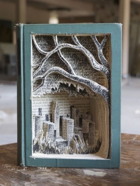 And finally, this incredible creation made from carving and drawing on a book. 15 Photos Of Book Nook Shelf Inserts That Might Inspire Your Next DIY Craft Project Diy, Design, Altered Book Art, Altered Books, Sculptures, Old Books, Book Sculpture, Altered Art, Tree Grows In Brooklyn