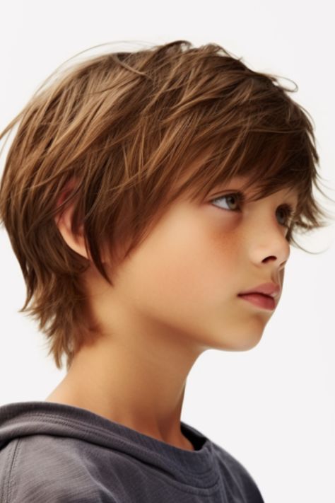 The choppy layers haircut adds depth to your appearance through varying lengths of hair. The gradual fade seamlessly blends into the top section creating dimension and texture. Click here to check out more trendiest boys haircuts for school. Boys Haircuts Medium, Boys Haircuts Long Hair, Boy Haircuts Short, Boy Haircuts Long, Boys Long Hairstyles Kids, Kids Hair Cuts, Trendy Boys Haircuts, Medium Length Boy Haircuts, Shaggy Haircuts For Boys