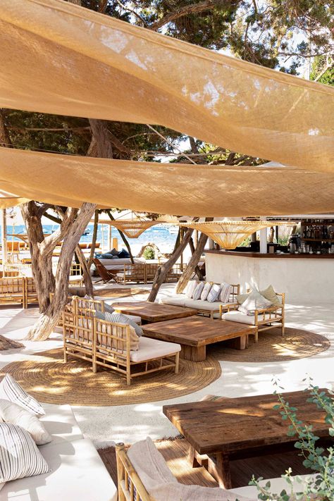 [h3]CASA JONDAL, IBIZA[/h3] What a summer to open a restaurant. Ibiza was quiet in 2020. An unusual hush echoed around the ochre cliffs of the south-west coast. But sandwiched between the Champagne-popping at Blue Marlin and the family buzz of Tropicana, Casa Jondal has been a runaway hit. The Dutch and Spanish owners have reimagined the traditional finca into something understated and elegant, slinging cotton sails from the twisted branches of sabina trees and dialling the food up to 11. The m Ibiza, Tulum, Beach Resorts, Beach Restaurant Design, Beach Bars, Beach Cafe, Beach Shack, Ibiza Beach Club, Beach Lounge