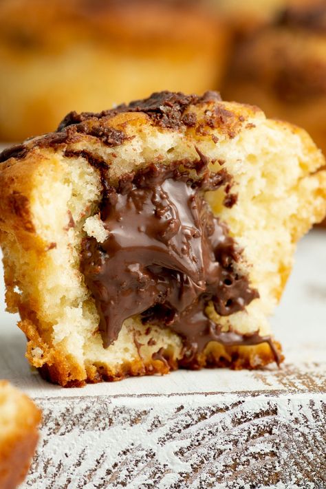 With a gooey Nutella center and a delicious swirl of Nutella on the muffin tops, these Nutella muffins are super moist, fluffy and tender!