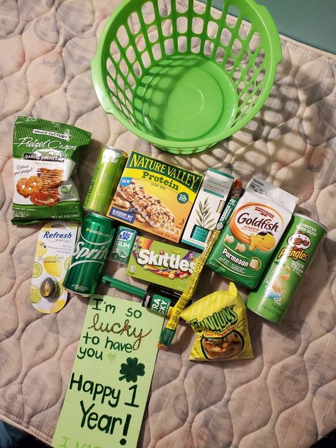 My boyfriend and I's anniversary happens to be on St. Patties Day so I made him a little green gift basket with snacks and useful things. Mostly dollar store stuff. Gift Ideas, Gift Baskets, Teacher Appreciation, Care Packages, Snack Gift Basket, Green Themed Gift Baskets, Themed Gift Baskets, Green Snack Basket, Yellow Snack Basket