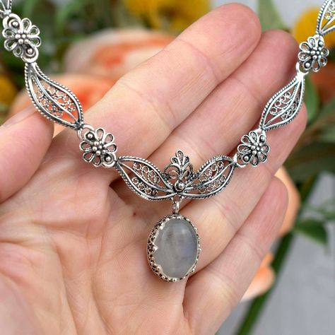 ✨ Adorn your neckline with the mystique of the moon! Our Gray Moonstone Sterling Silver Pendant is not just a piece of jewelry—it's a wearable piece of fine art. Dainty filigree work encases the enchanting gem, creating a masterpiece fit for a princess. Whether you're treating yourself or searching for a captivating gift, this charm is a treasure to cherish. ✨ Dive into the world of elegance: 👉 [https://nuel.ink/ztQ0iR #MoonstoneMagic #ElegantJewelry #GiftHer #GemstoneGlow #SilverSophistica... Design, Bijoux, Sterling Silver Pendants, Sterling Silver Filigree, Moonstone Sterling Silver, Sterling Silver Necklaces, Silver Jewelry, Gemstone Necklace, Pendant Necklace