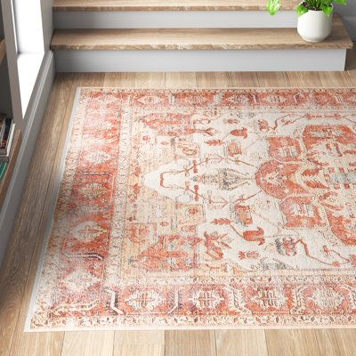 This area rug showcases a floral motif inspired by Persian patterns, bringing a boho feel to your space. It's power-loomed in Turkey from cotton, chenille, and polyester, and it features a traditional central medallion design. This rug is purposefully distressed for a laid-back feel, and it has a neutral orange and beige palette. We love how its 0.17" low pile height makes it the ideal base for busy spaces like your entryway, hallway, or living room. To care for this area rug, vacuum it with no Oriental, Orange Rugs, Rugs In Living Room, Ivory Rug, Orange Area Rug, Beige Area Rugs, Carpet Orange, Green Rug Bedroom, Green Rug