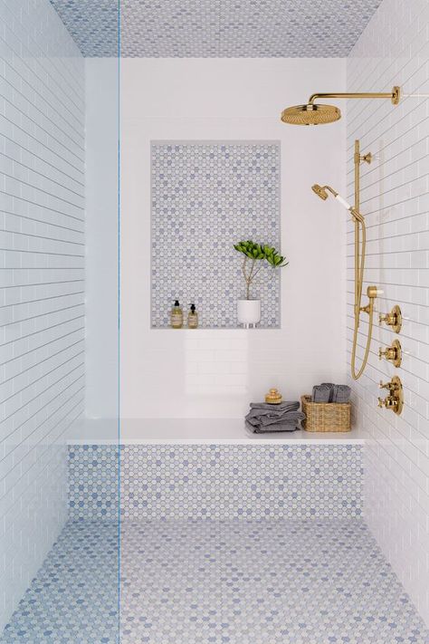 a coastal shower space done with white and blue tiles, a niche, a bench, some towels and gold fixtures Bathroom Interior, Interior, Bathroom Interior Design, Bathroom Design, Bathroom Remodel Designs, Bathrooms Remodel, Bathroom Remodel Master, Bathroom Inspiration, Bathroom Inspiration Decor