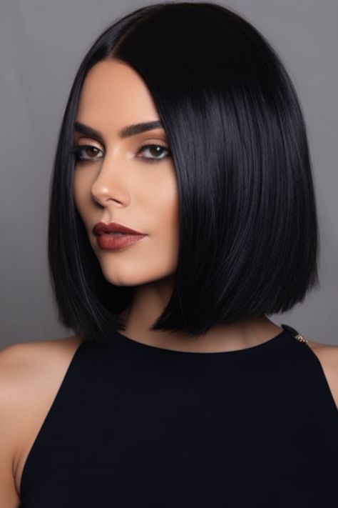 The elegant midnight black sleek bob epitomizes sophistication and gracefulness. The dark shade complements any skin tone while the sleek finish can be achieved using an iron. Click here to check out more cute and fun shoulder-length haircuts and hairstyles. Shoulder Length Hair, Winter, Medium Length Bobs, Round Face Haircuts, Short Hair Cuts For Round Faces, Short Hair Styles For Round Faces, Shoulder Length Hair Cuts, Shoulder Length Bob Haircut, Shoulder Length Bob