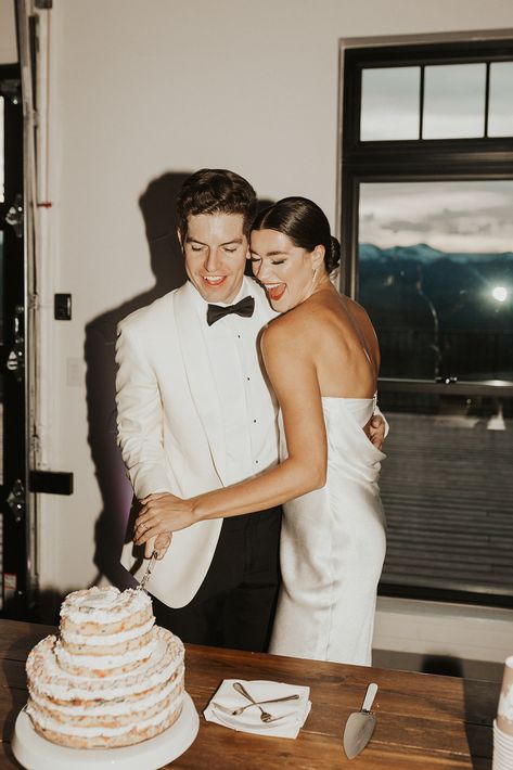 A groom in a white suit with black bowtie, and a bride with a sleek bun and cocktail dress cut a milk bar cake at their wedding. Wedding Receptions, Wedding Shot, Wedding Shots, Wedding Party Photography, Wedding Party Photos, Wedding Reception Photography, Vintage Wedding Photos, Wedding Shot List, Wedding Ceremony Photos