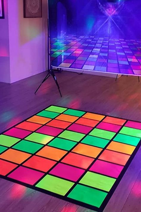 A neon party is a great excuse to throw a dazzling disco with great music and bright colors. Blacklights were really popular in the '70s, so how about throwing a '70s-themed disco with a retro music playlist? This florescent-colored dance floor is just what you need at your party to add to the disco vibe! See more party ideas and share yours at CatchMyParty.com Prom, Glow Party, Neon, Retro, Neon Dance Party, Disco Night, Neon Party Decorations, Disco Party Decorations 70s, Disco Decorations