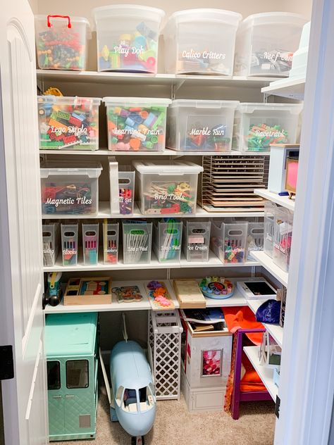 Toy storage closet in a playroom. We used Ikea Boaxel shelving to transform this storage closet. Now that we can better utilize all that vertical space and make this storage closet truly function well for this family. I love the vinyl custom labels that were made and the multipurpose bins from the container store. Toys, Storage For Kids Toys, Playroom Toy Storage Ideas, Toy Room Storage, Toy Storage Shelves, Kid Toy Storage, Toy Storage Bins, Toy Room Organization, Toy Closet Organization