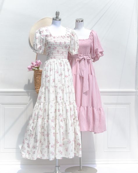 A stunning floral maxi, the In Bloom Dress features a beautful pink floral print on cream cotton, breezy full skirt, square neckline, puffed sleeves, and a smocked elastic bodice for a comfortable, flattering fit. Pair it with a woven sunhat for a romantic summertime look! Pictured with the Betsy midi in pink 🎀 Floral Skirt Outfits, Bloom Dress, Stylish Work Outfits, Pink Floral Print, Inspired Outfit, Proverbs 31, Puffed Sleeves, Smock Dress, Floral Maxi