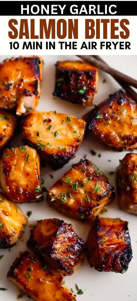 This quick and easy recipe for healthy Air Fryer Honey Garlic Salmon Bites offers succulent, bite-sized pieces of salmon coated in a sweet and garlicky sauce, cooked to perfection in your air fryer or Ninja Foodi in under 15 minutes! Make for meal prep and serve with rice, quinoa, in a stir fry, or on top of steamed vegetables! Salmon, Healthy Recipes, Stir Fry, Salmon In Air Fryer, Air Fryer Recipes Salmon, Air Fryer Healthy, Air Fryer Recipes Healthy, Air Fryer Dinner Recipes, Air Fryer Recipes