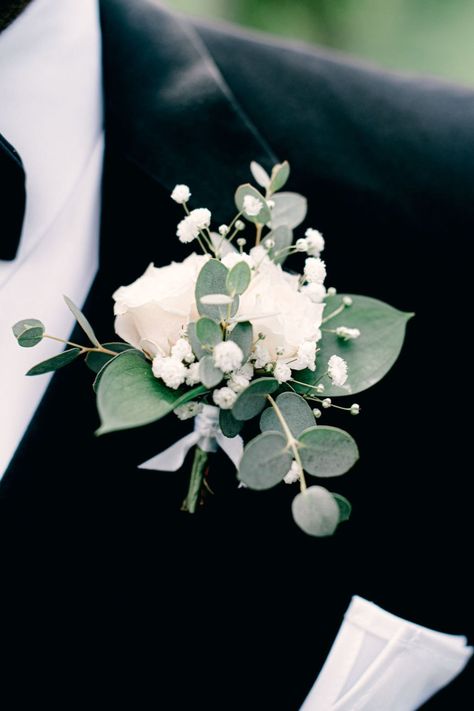 A white groom's boutonniere by Flor Amor, Austin TX. Features white spray roses and delicate baby's breath with assorted greenery. Floral, Wedding Flowers, Hochzeit, Bodas, Boda, Bridal Flowers, Prom Flowers, Mariage, Wit