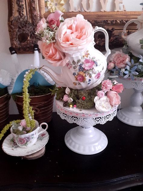 Teapot tilted, moss greenery to cover added items for detail Teapot Centerpiece, Tea Cup Decor, Teapot Decorations, Vintage Tea Party Decorations, Tea Cup Decorations, Tea Cup Centerpieces, Teapot Centerpiece Wedding, Tea Party Table, Tea Party Table Decorations