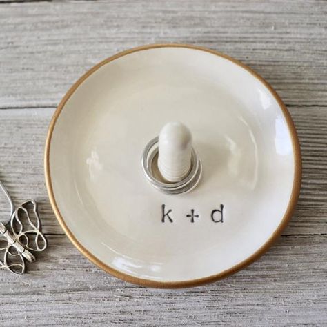 This ring holder or minimalist ring cone dish makes a great personalized wedding gift or engagement gift for couples.  It features a ring stand with their two initials separated with a plus sign.  So sweet!  Handmade just for you, this personalized gift will be unique.  This ceramic ring cone dish will keep her ring secure when she takes it off.  She can use it in the kitchen, bath or bedroom and it will be a reminder of their special day.Promise Pottery:  handcrafting ring dishes personalized y Engagements, Wedding Gifts, Mugs, Fimo, Ring Holder Wedding, Personalized Wedding Gifts, Ring Dish, Ring Holder, Monogram Ring Dish