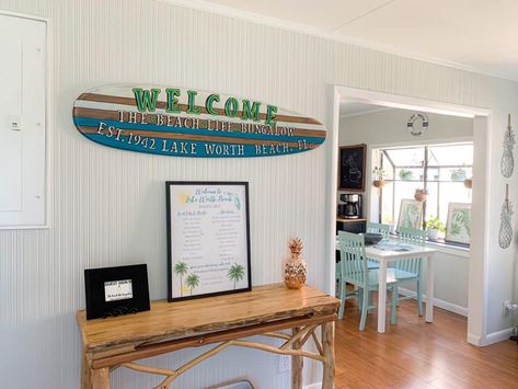 Customized Surfboard Sign With House Name - AirBnb Decor Tricks To Wow Your Guests Ideas, Decoration, Beach Rental Decor, Rental Decorating, Small Beach Houses, Surfboard, Rental, Lake House Interior, Small Condo