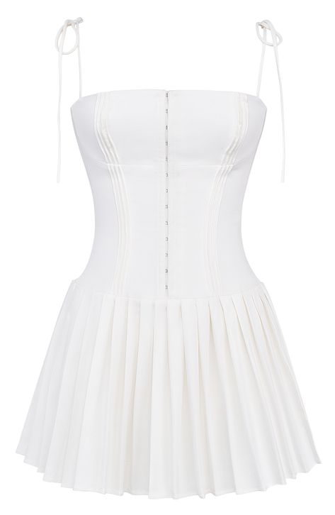 Dainty tie straps top this pretty mini boasting a corseted bodice, a flared skirt adorned by textural pleats and a softly peached finish. Exclusive retailer Square neck Adjustable tie straps 65% Richcel viscose, 35% polyester Dry clean Imported Victoria, Outfits, Tutus, Corset Mini Dress, Corset Dress, Dress And Heels, White Corset Dress, Pleated Dress, White Pleated Skirt