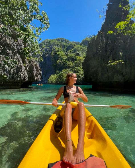 Girl kayaking in a deep turquoise lagoon. The colour of the kayak stands out against the water and sky. It’s very sunny Rio De Janeiro, Asia Travel, Indonesia, Palawan, Thailand, Bali Trip, Bali Travel, Malaysia Travel, Backpacking Asia