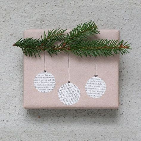 Creative Gift Wrap Ideas for Christmas Presents - Cut out some old newspaper or magazine clippings into circles. Paste on to your gift, draw on the hooks and hangers, and glue some fresh evergreens (steal them from your Christmas tree) across the top. Natal, Gifts, Weihnachten, Kerst, Jul, Basteln, Creative Diy Gifts, Creative Gifts, Natale