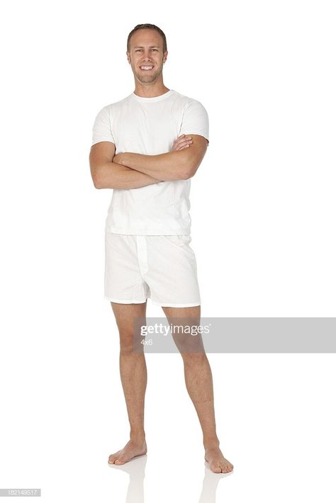 Stock Photo : Happy man standing with his arms crossed
