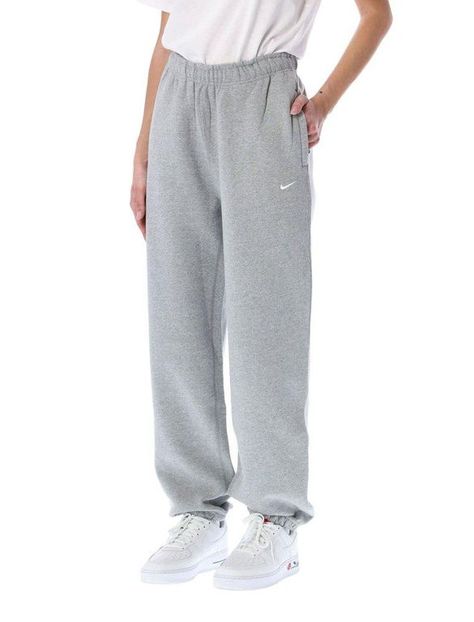 Women's Nike Solo Swoosh Fleece Pants - Blue - Sweatpants ESSENTIAL STAPLE. Premium fabric and a laid-back design highlight the Nike Solo Swoosh Pants. Part of the Essentials collection, these pants use a soft feel with a loose fit for all-day wear. Benefits Brushed-back fabric delivers soft warmth. Drop-in pockets offer easy-access storage. An elastic waistband with a drawcord lets you adjust the fit. Elastic cuffs help seal in warmth. Product Details Loose fit for a roomy feel Embroidered Swoo Nike, Trousers, Models, Tracksuit Bottoms, Sweatpants Nike, Sweatpants, Fleece Sweatpants, Active Wear Pants, Fleece Joggers