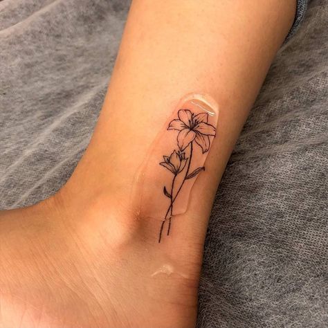 Tattoo, Hand Tattoos, Flower Tattoo On Ankle, Flower Ankle Tattoos, Lilly Tattoo Design, Small Lily Tattoo, Lily Tattoo Design, Dainty Tattoos, Small Flower Tattoos