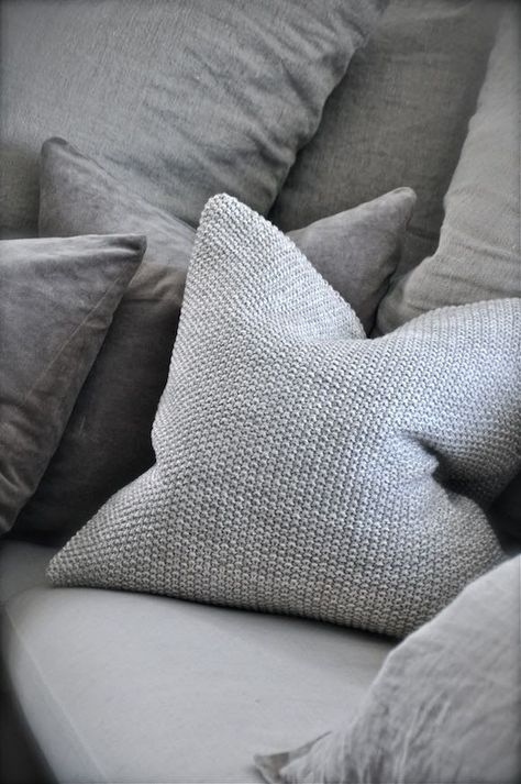 I love these gray nubby-knit pillows — currently available at FABLE + FLAME.  We also stock a cozy throw in the same knit!