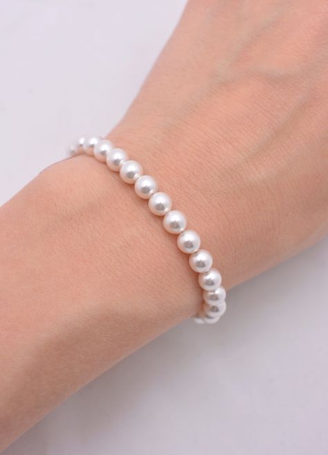 This beautiful pearl bracelet features dainty 6mm high-end crystal pearls (available in 5 colors), perfect for a delicate look. Measures to fit a 6 inch wrist with 1.5 inch extension chain. The silver plated extension chain and lobster clasp complete the bracelet. Pearl available in white (shown), ivory, light pink, light grey, and dark grey. Comes in a gift box. These make great bridesmaid gifts. Bracelets, Beaded Jewellery, Jewellery Bracelets, Bijoux, Victoria, Bracelet Set, Pearl Strand Bracelet, Wedding Jewelry Bracelets, Jewelry Bracelets