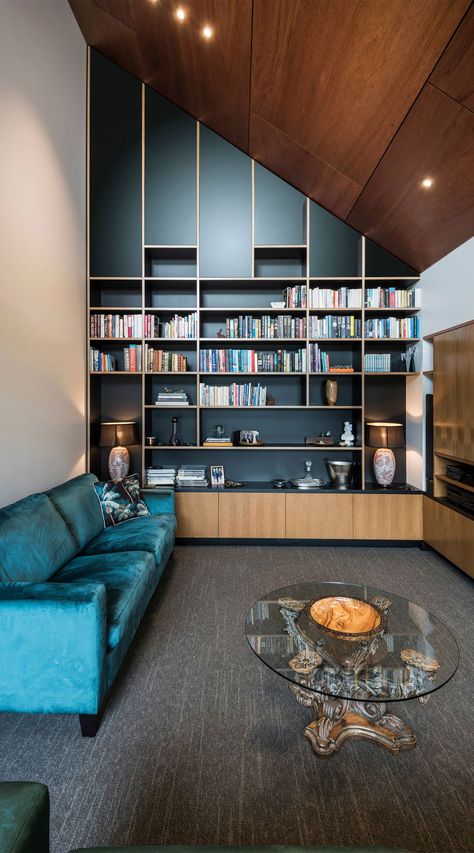 Contemporary Living Room With Blue Velvet Sofa And Black Accent Wall Modern Home Library Ideas, Modern Home Library, Home Library Design Ideas, Home Library Rooms, Contemporary Lounge, Bookshelves In Living Room, Home Library Design, Lounge Design, Home Libraries