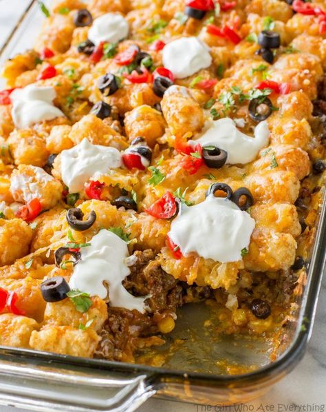 Tater Taco Casserole - A Mexican mixture of taco meat, beans, corn, and cheese topped with tater tots and enchilada sauce. the-girl-who-ate-everything.com Dinner Recipes, Casserole Recipes, Paleo, Meals, Sandwiches, Enchiladas, Main Dish Recipes, Quick Recipes, Easy Meals