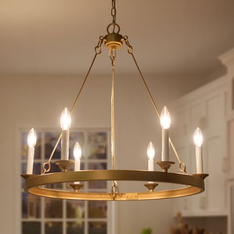 Elegant and understated, this timeless 6-Light Candle Style Wagon Wheel Chandelier metal chandelier adds character to any living room or dining room. Metal, Glow, Round Chandelier Dining Room, Copper Chandelier, Gold Chandeliers Dining Room, Round Chandelier, Mid Century Modern Gold Chandelier, Modern Gold Chandelier, Ceiling Pendant Lights