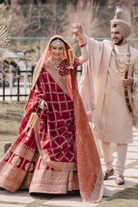 Sikh bride in a deep red Sabyasachi lehenga with the groom in an Ivory outfit Wedding Poses, Indian Bridal Wear, Indian Wedding Poses, Couple Dress, Indian Bride, Indian Wedding Couple, Couple Wedding Dress, Indian Bride Outfits, Indian Wedding Outfits