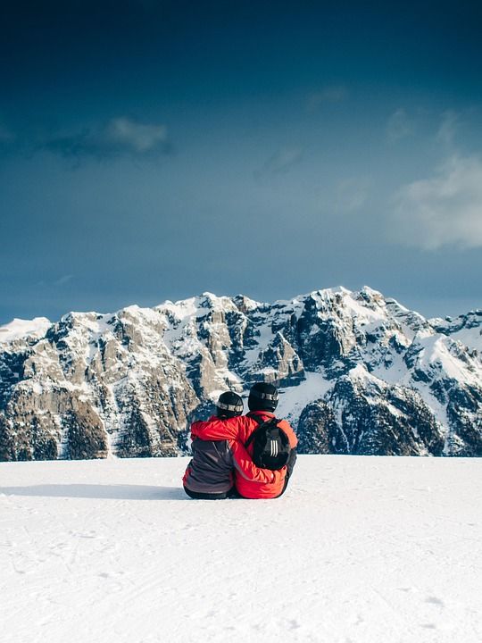 two people sitting on top of a snow covered slope with the words last minute ideas for valentine's day