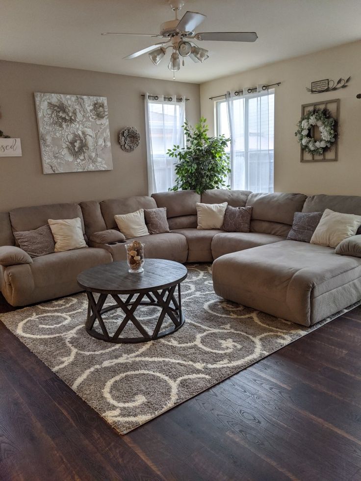 a living room filled with furniture and a large rug