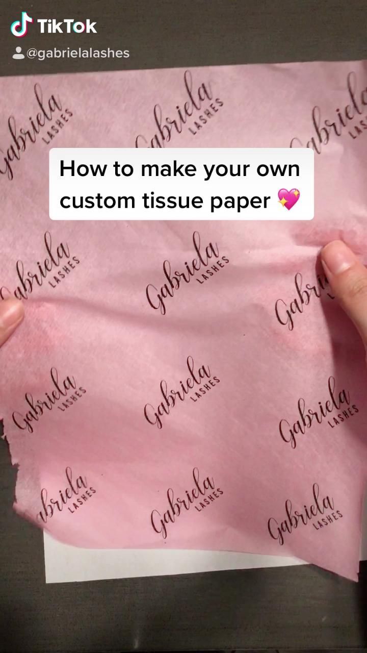 someone holding up a piece of paper with the words how to make your own custom tissue paper