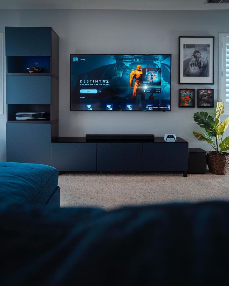 a flat screen tv mounted on the wall in a living room