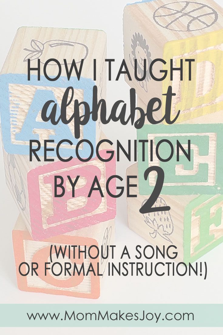 three wooden blocks with the words how i taught alphabet recognition by age 2 without a song or formal instruction