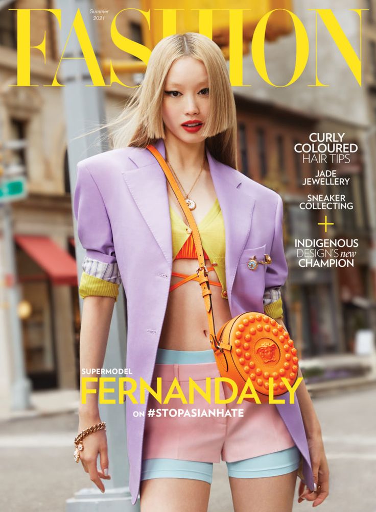 the cover of fashion magazine, featuring a woman in short shorts and a purple jacket