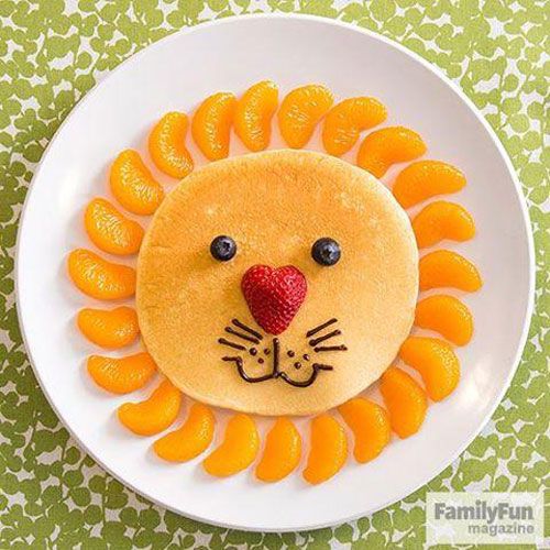 a lion made out of pancakes on a plate